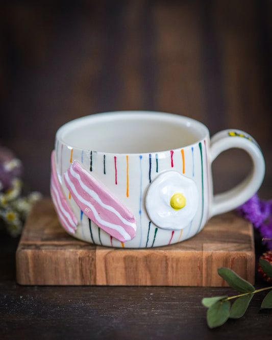 Egg and bacon short mug on porcelain
